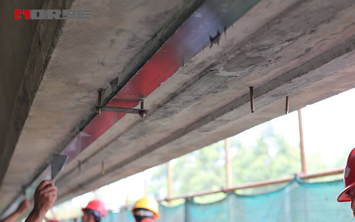 Prestressed carbon fiber laminate reinforced concrete bridge with damage